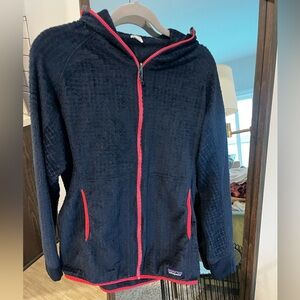 Patagonia R3 fleece Y2K navy jacket with orange piping.